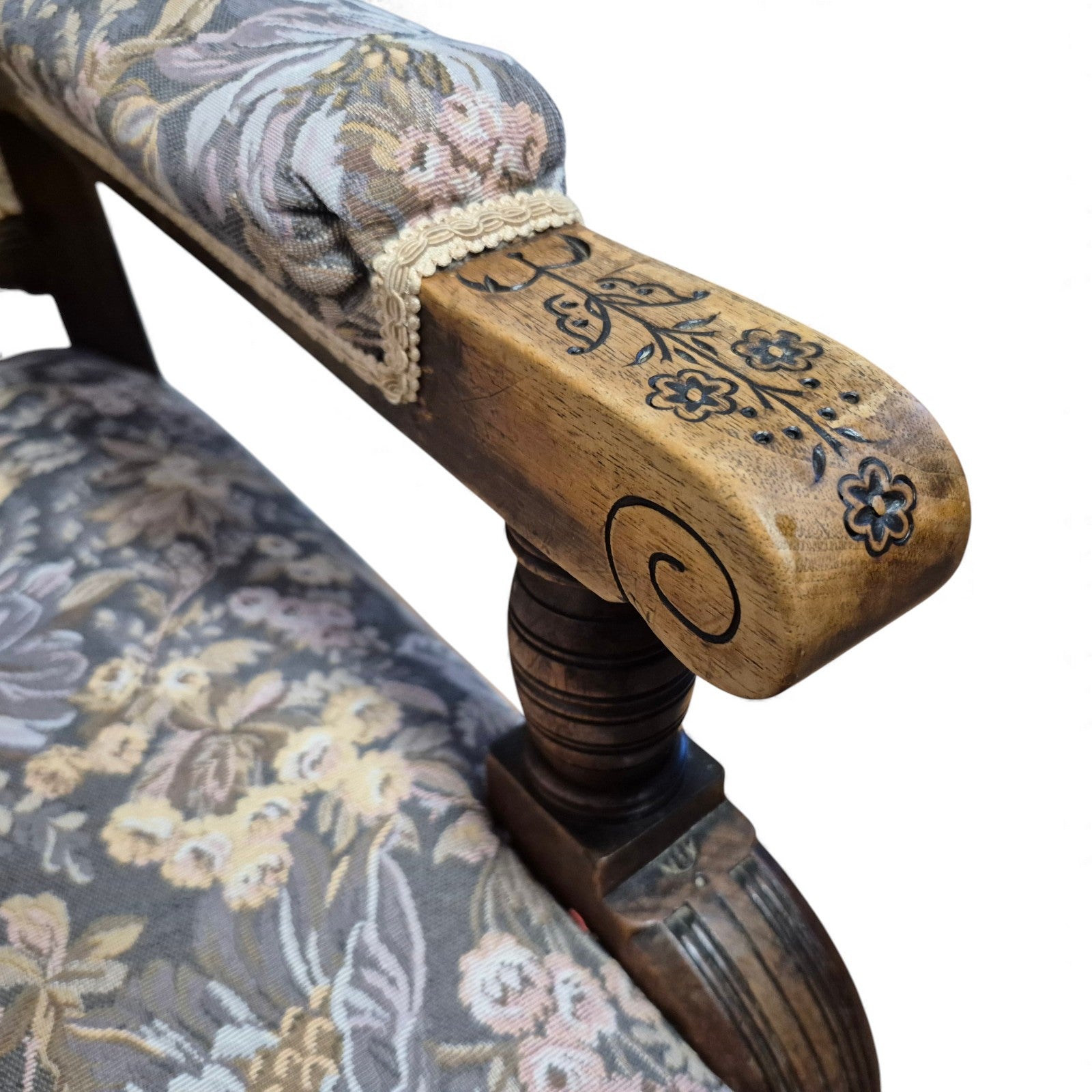 Close-up of carved arm detail on Victorian oak nursing chair