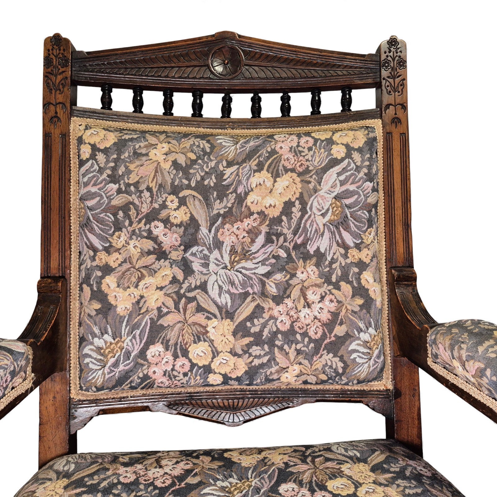 Close-up of carved crest rail on Victorian oak nursing chair