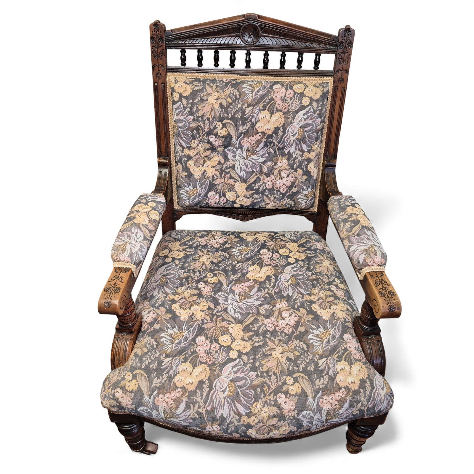 Vintage floral upholstered seat and armrests on antique oak chair