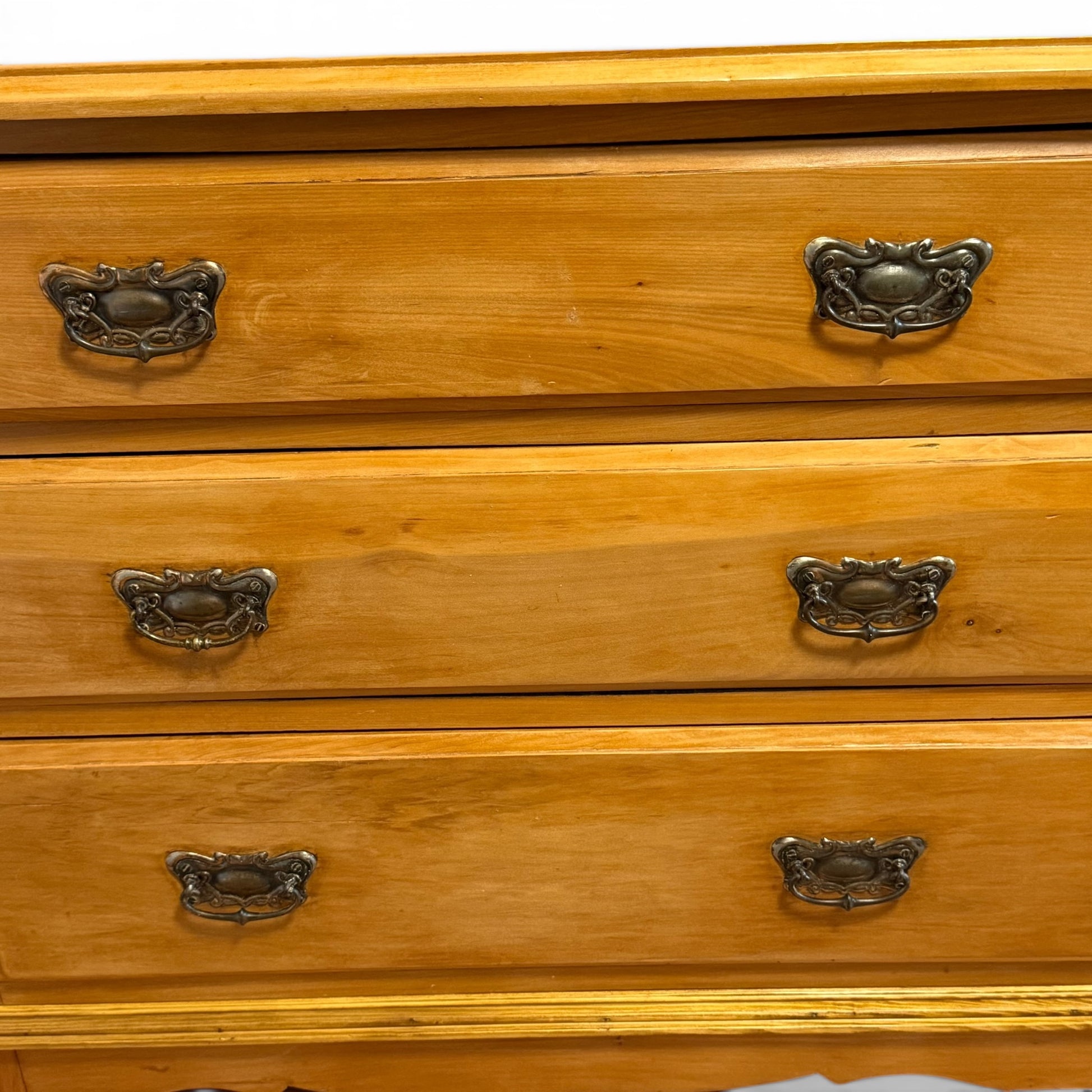 Detail of Victorian pine chest drawer fronts and handles