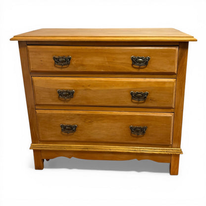 Front view of Victorian pine chest of drawers with three storage drawers