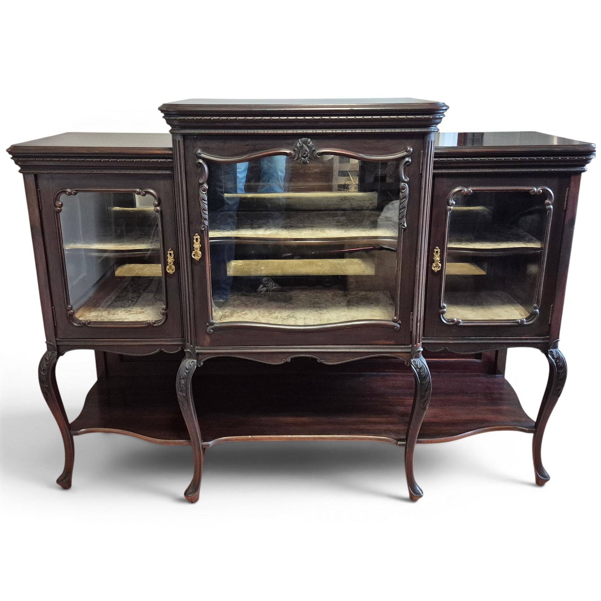 Victorian mirror-backed display cabinet with glazed doors and carved mahogany frame