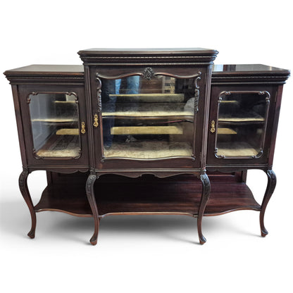 Victorian mirror-backed display cabinet with glazed doors and carved mahogany frame