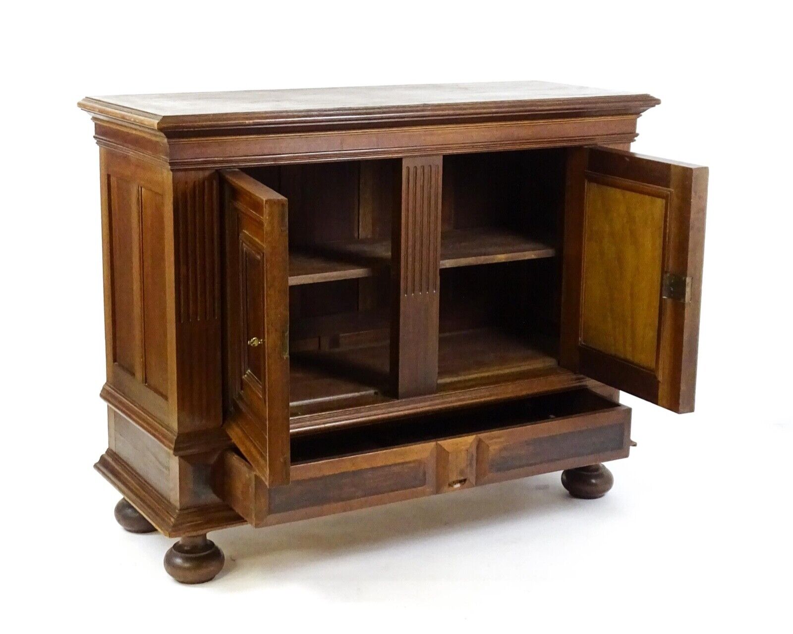 View of antique walnut cupboard with storage drawer and doors open