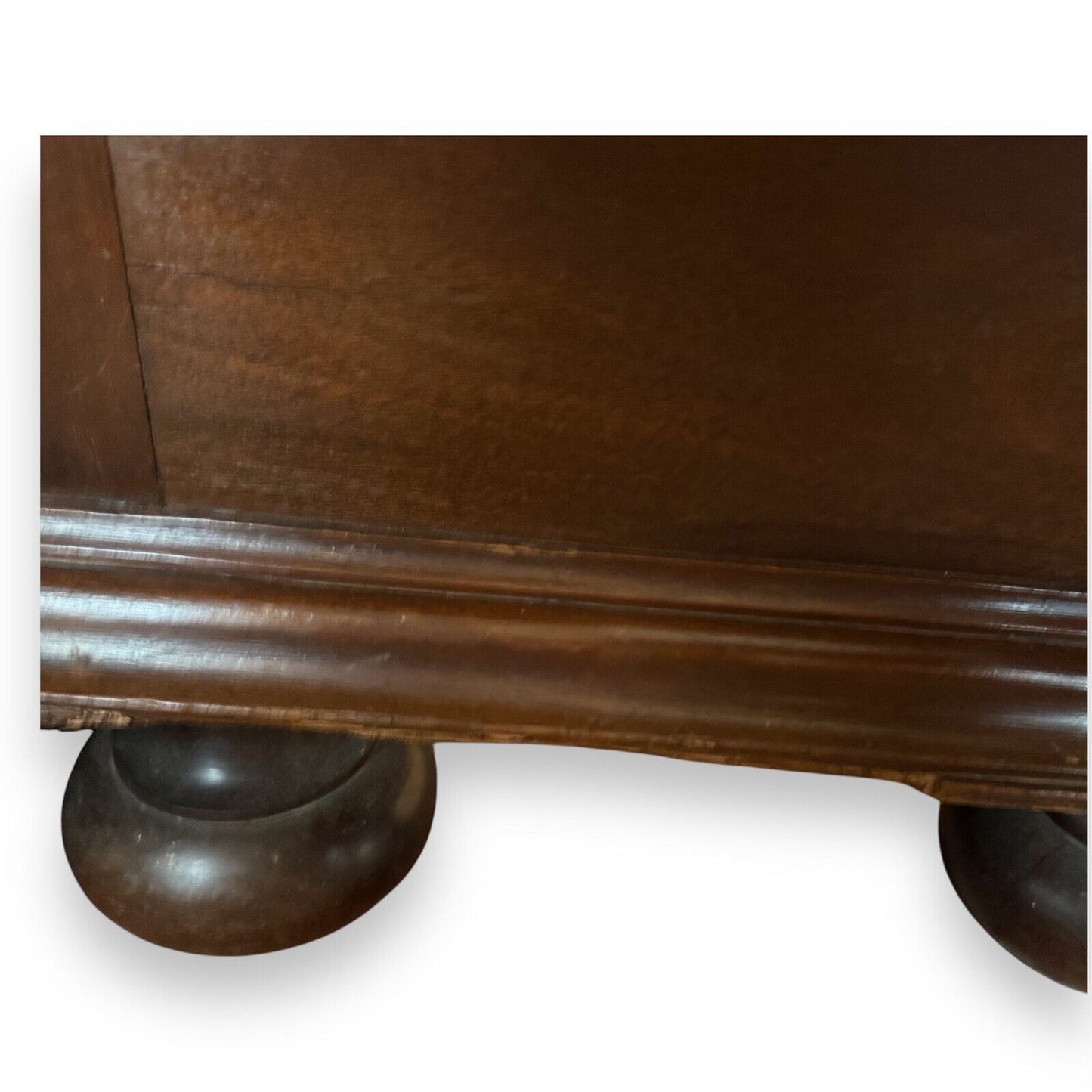 Close-up of decorative moulding on Victorian walnut sideboard