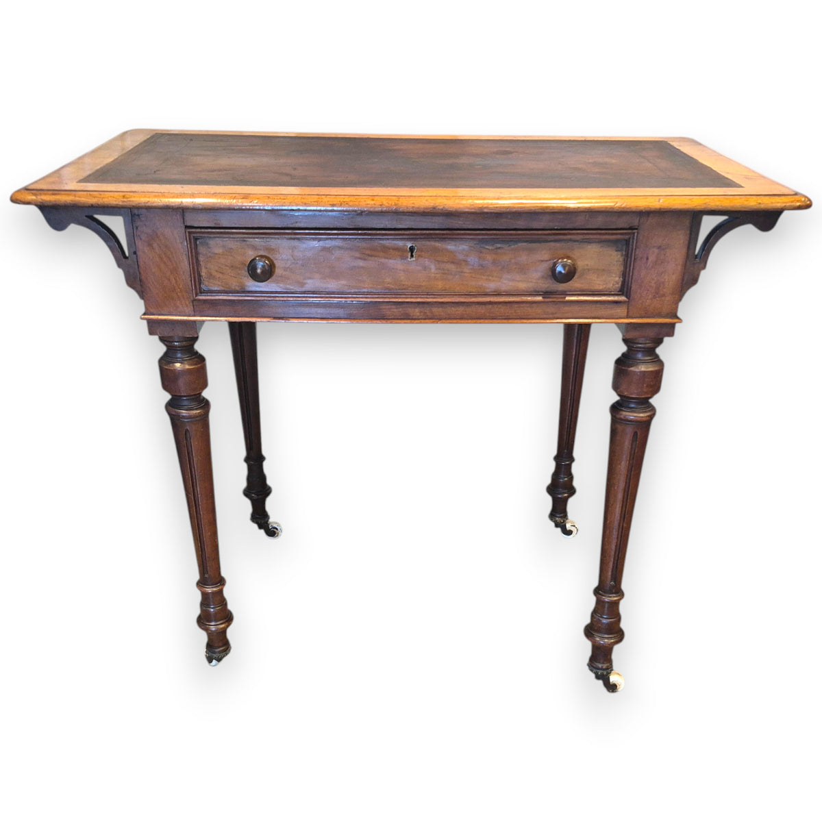 Turned Victorian walnut desk legs with original-style castors