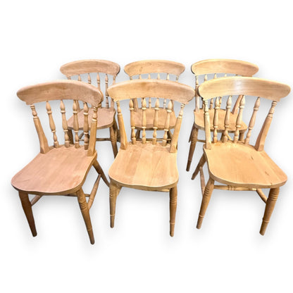 Set of six vintage beech farmhouse dining chairs – front view showing spindle backs