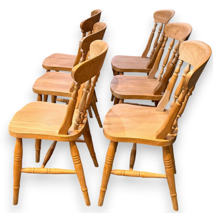 Vintage beech chairs – side profile showing shaped seats and turned legs