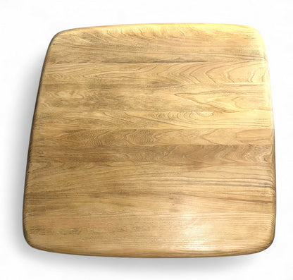 Close-up of wax-finished elm grain on Ercol coffee table