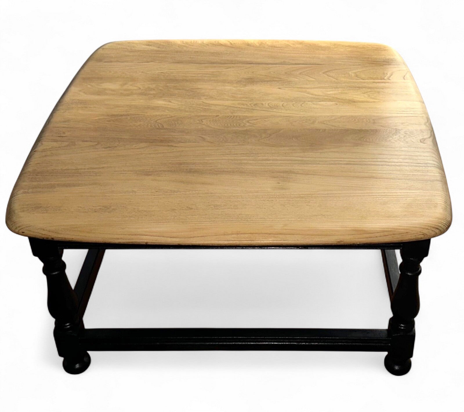 Vintage Ercol elm coffee table with restored top and black painted satinwood base