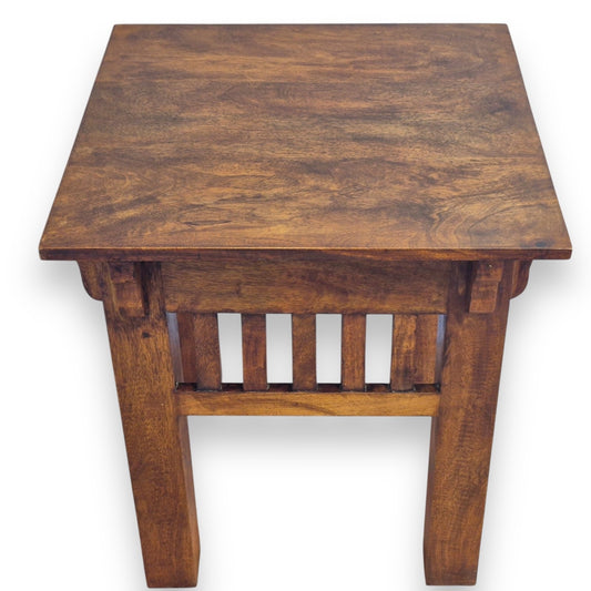 Sheesham wood coffee table – angled view highlighting grain and carved details