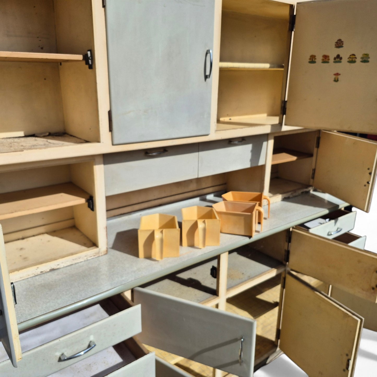 Retro kitchen cabinet – open doors revealing internal storage space