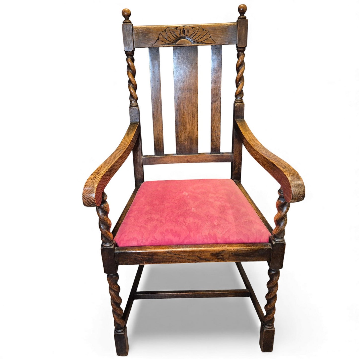 Front view of Antique-style oak hall chair with barley twist supports and red upholstered seat