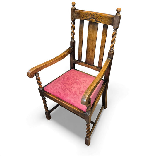 Antique-style oak hall chair with barley twist supports and red upholstered seat