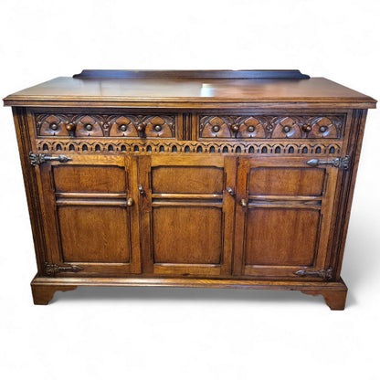 Tudor style oak sideboard with drawers and cupboards